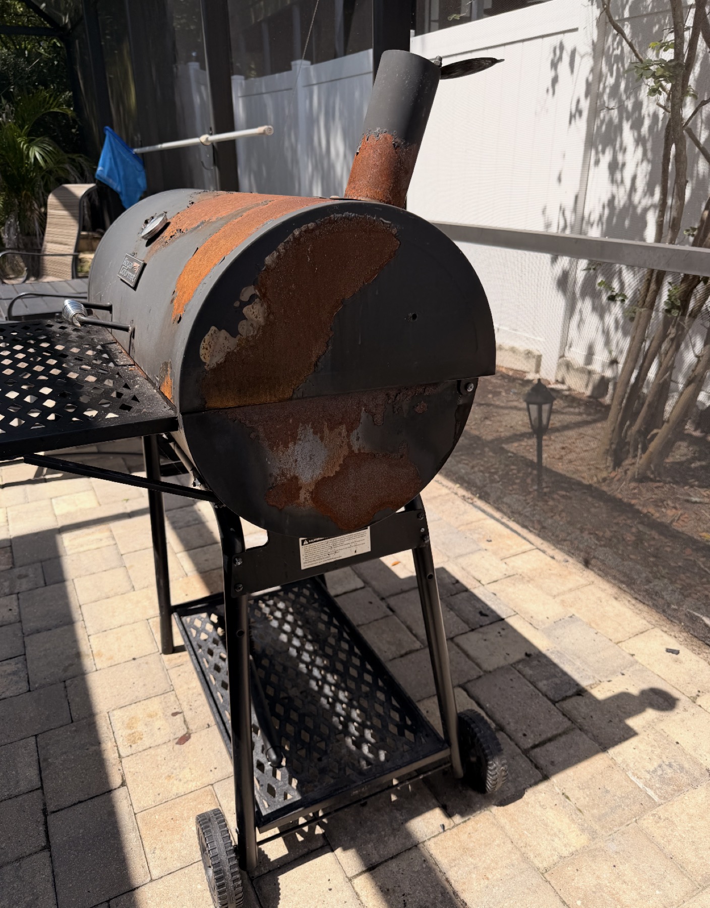 Rust repair prep on outdoor grill restoration by Flourish Home Services