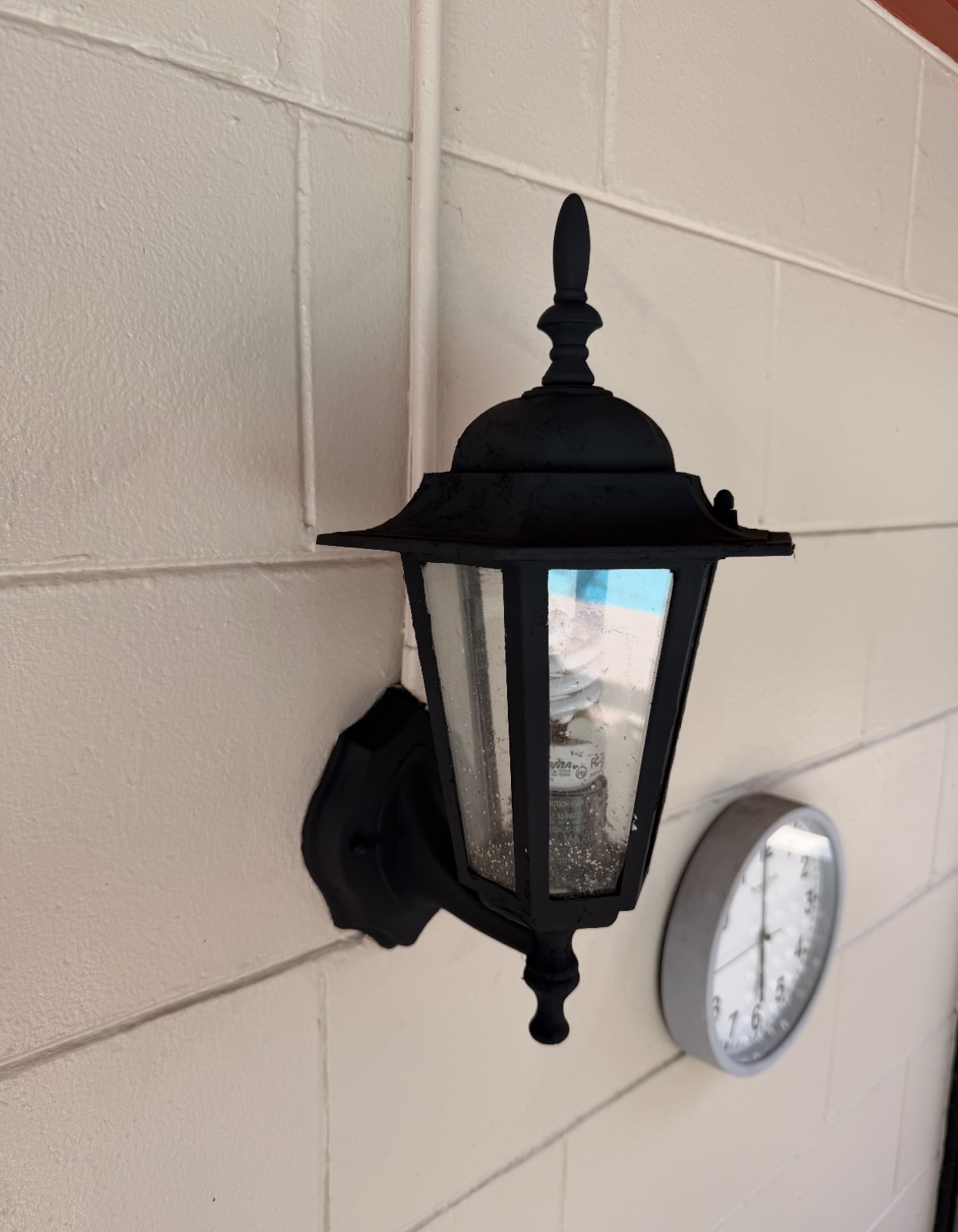 After outdoor light fixture refurbishment by Flourish Home Services in Tampa Bay