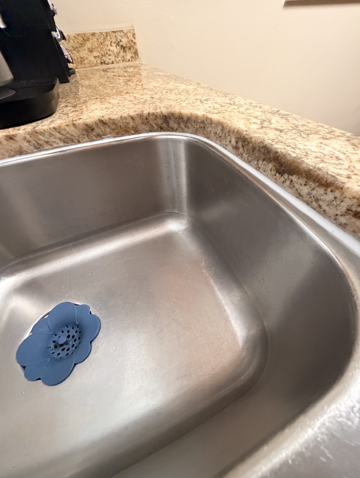 After clean kitchen sink recaulking by Flourish Home Services in Tampa