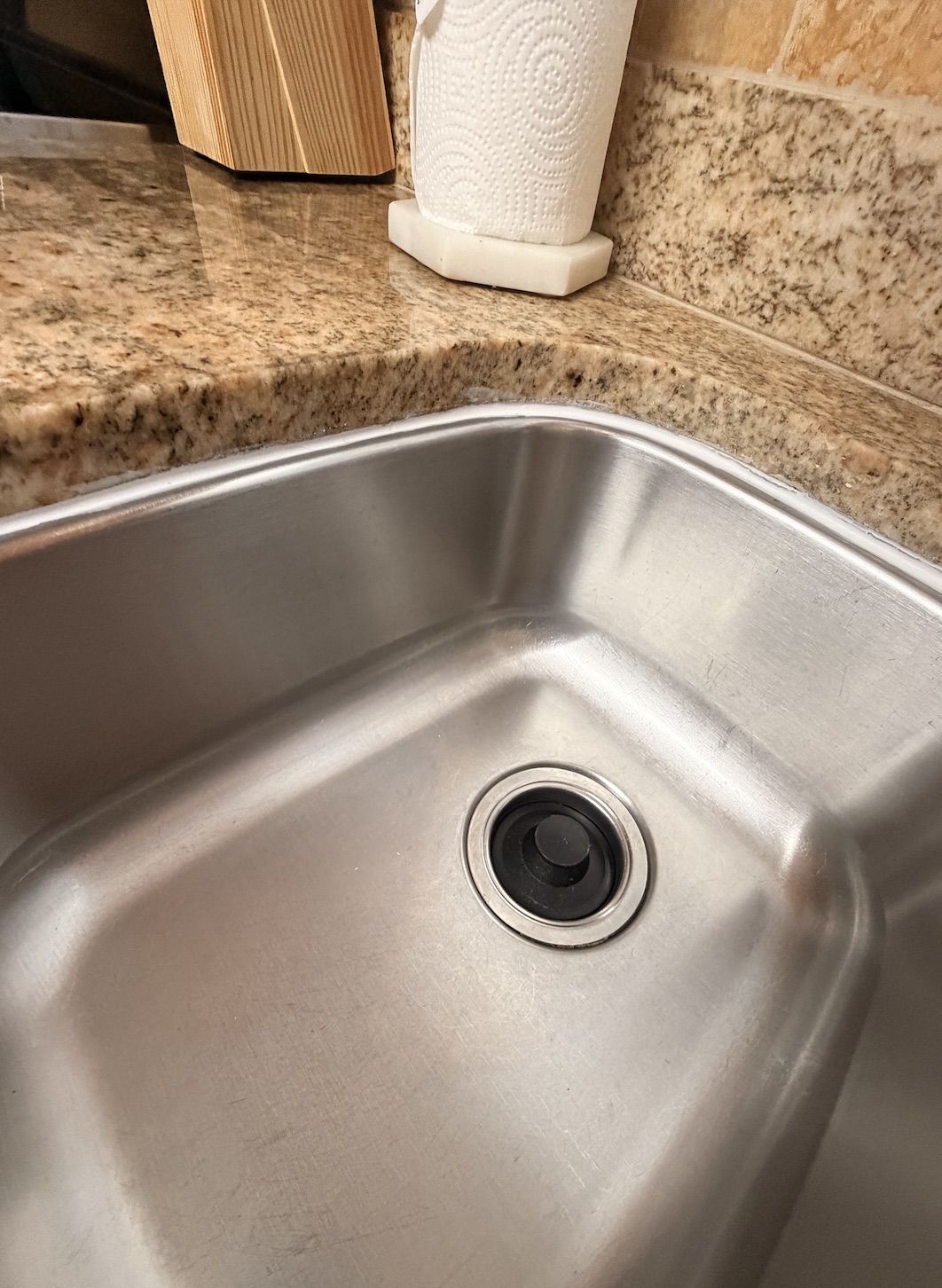 Finished kitchen sink caulk line and cleanup by Flourish Home Services